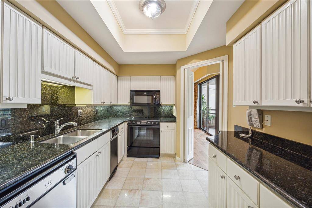Spacious kitchen with easy access to the dining area on the left and living room on the right.