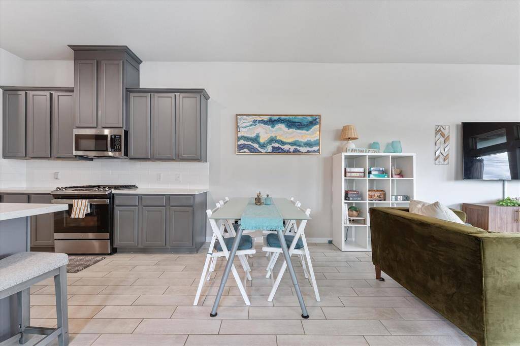 The dining room, open to both the kitchen and living room, creates a cohesive and functional space for gatherings.