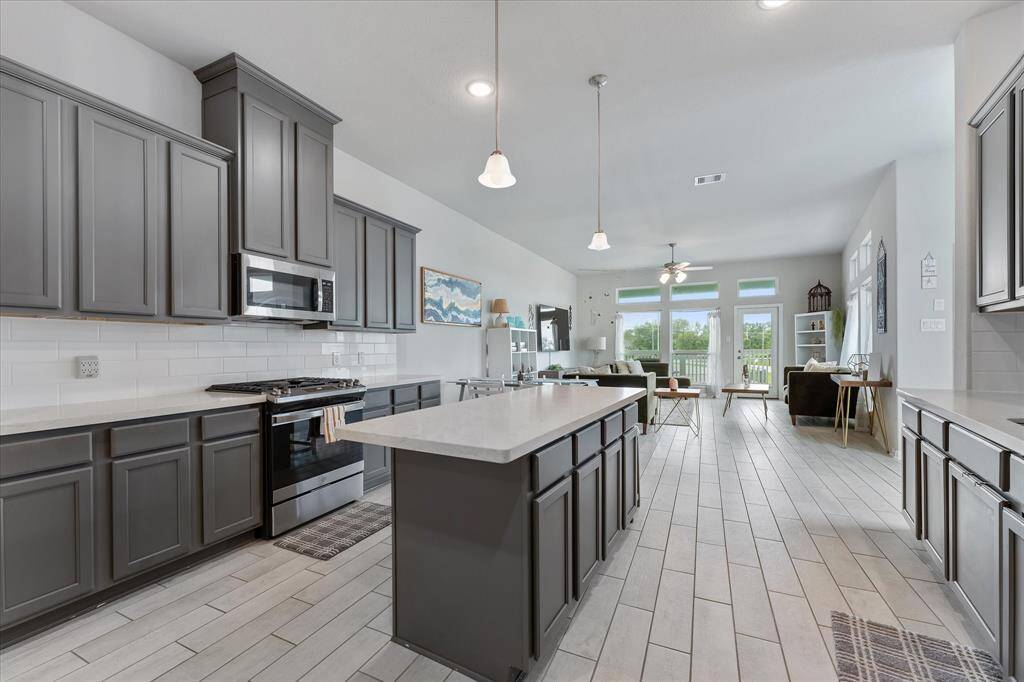 The modern kitchen is designed with ample storage and plenty of prep space.
