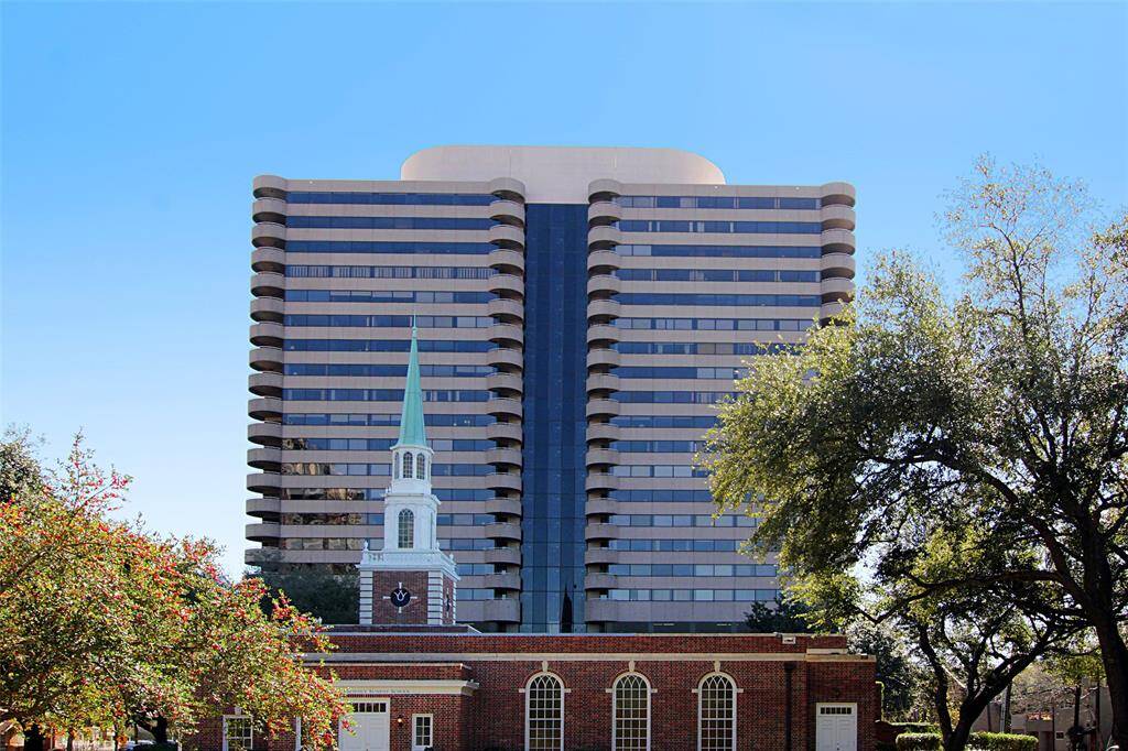 Full view of this modern high-rise building with a unique curved architecture.
