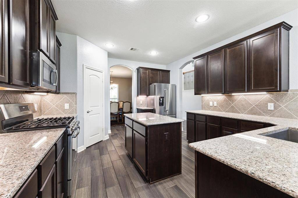 Ample Storage with Kitchen Cabinets and Pantry