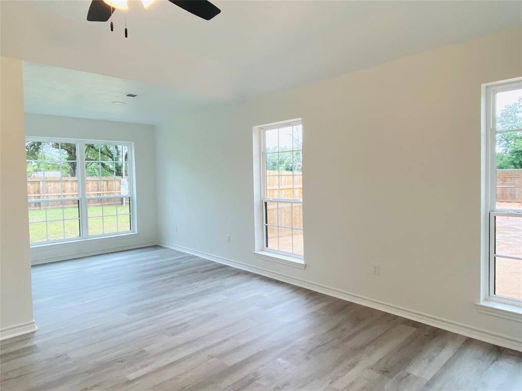 Extra space in primary bedroom ideal for treadmill, desk or sitting area!