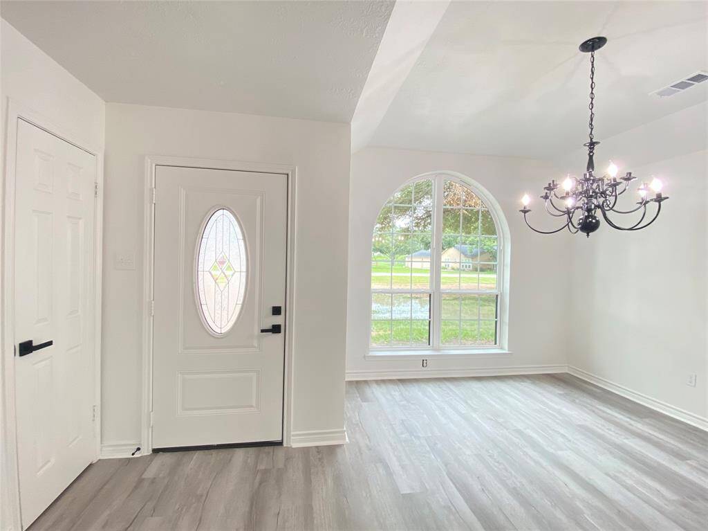 Formal dining area at front entry is open to living room