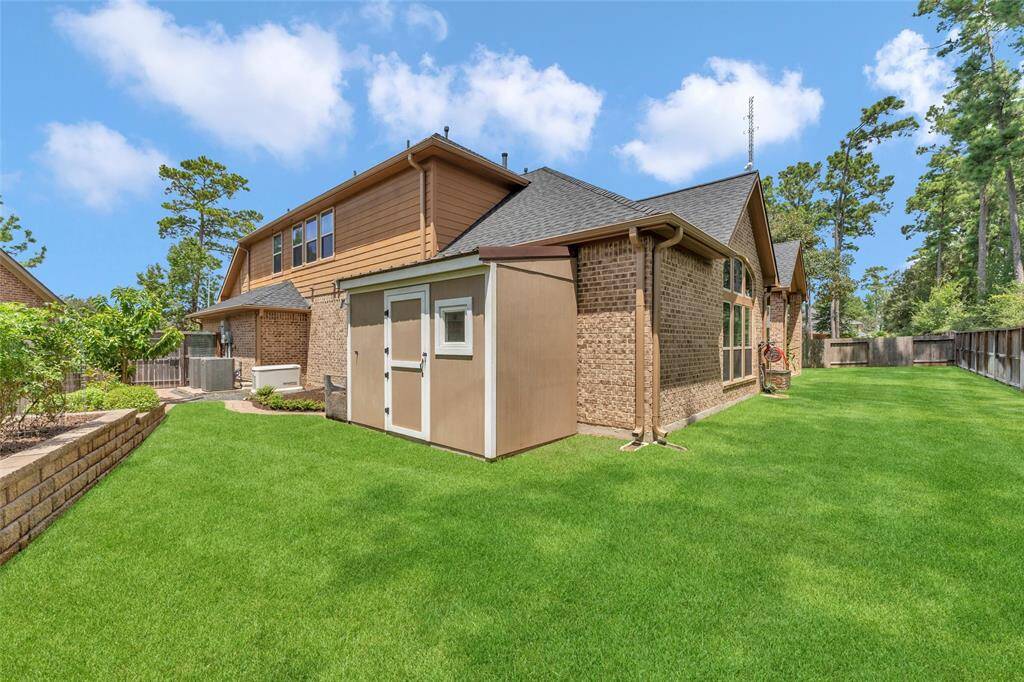 Large back yard with permanent storage shed