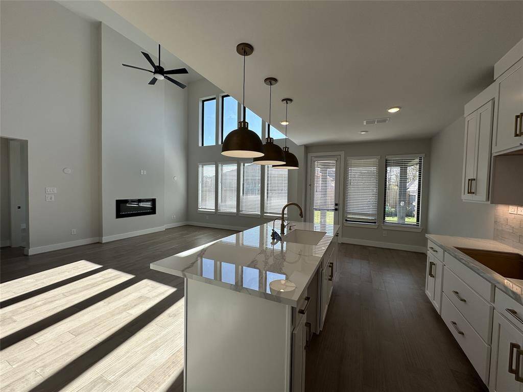 Pendent lighting a plus in this modern kitchen.