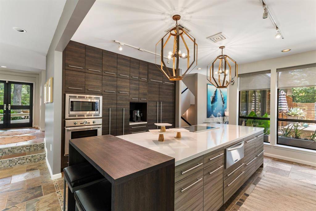 Thermador kitchen features generous storage to include a 48" Refrigerator/Freezer, Thermador Induction Ovens & warming drawer.
