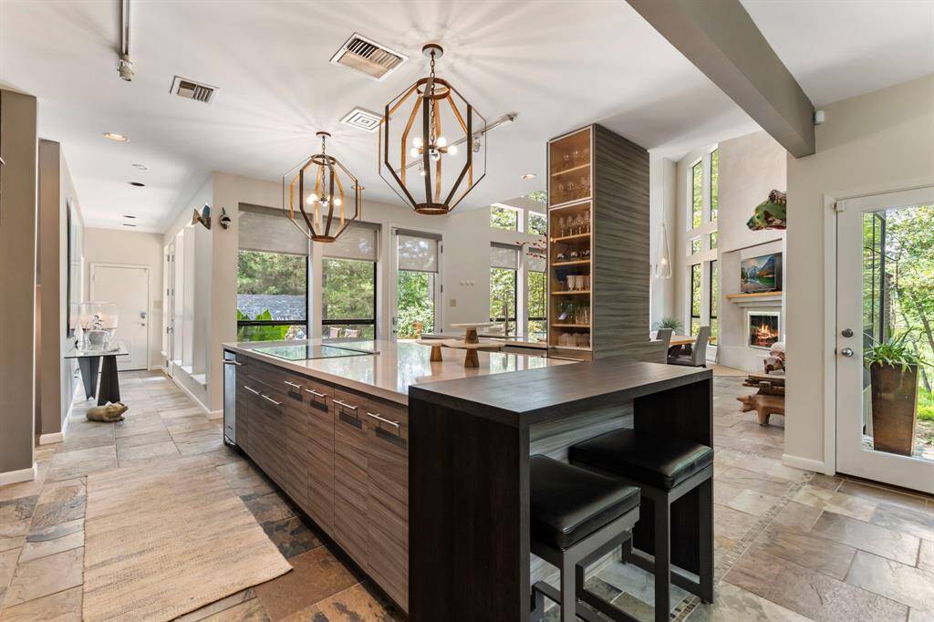 Wrapped in nature, the home enjoys plenty of natural light throughout.