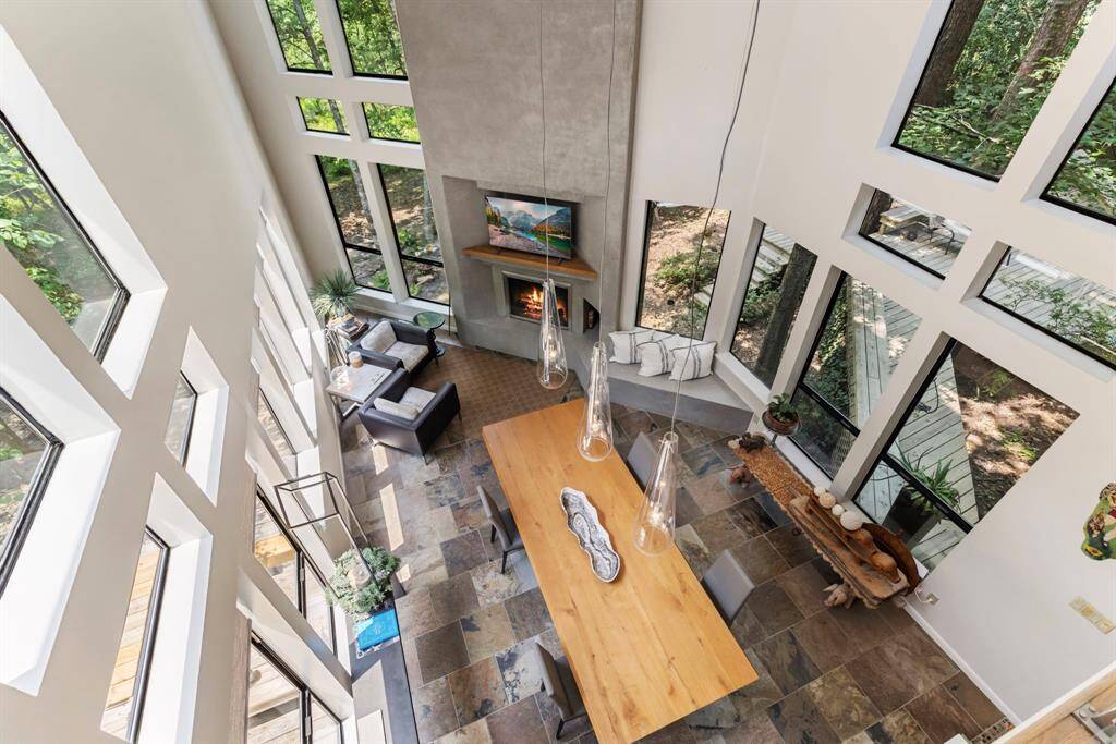 Retreat into the family room with a plaster fireplace and built-in wood storage box.