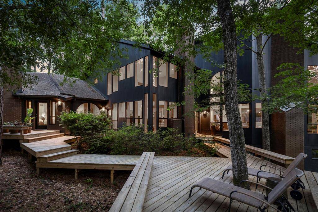 Incredible architectural design that incorporates the use of expansive, sleek windows elevates this stunning property to a unique and whole new level!