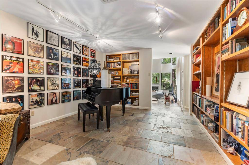 Music Room / Library - This space is ideal for any visionary boasting a wall of built-in display & storage.
