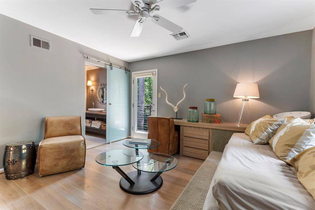 An incredible secondary bedroom features a sliding door to the en suite bath and has private balcony access.