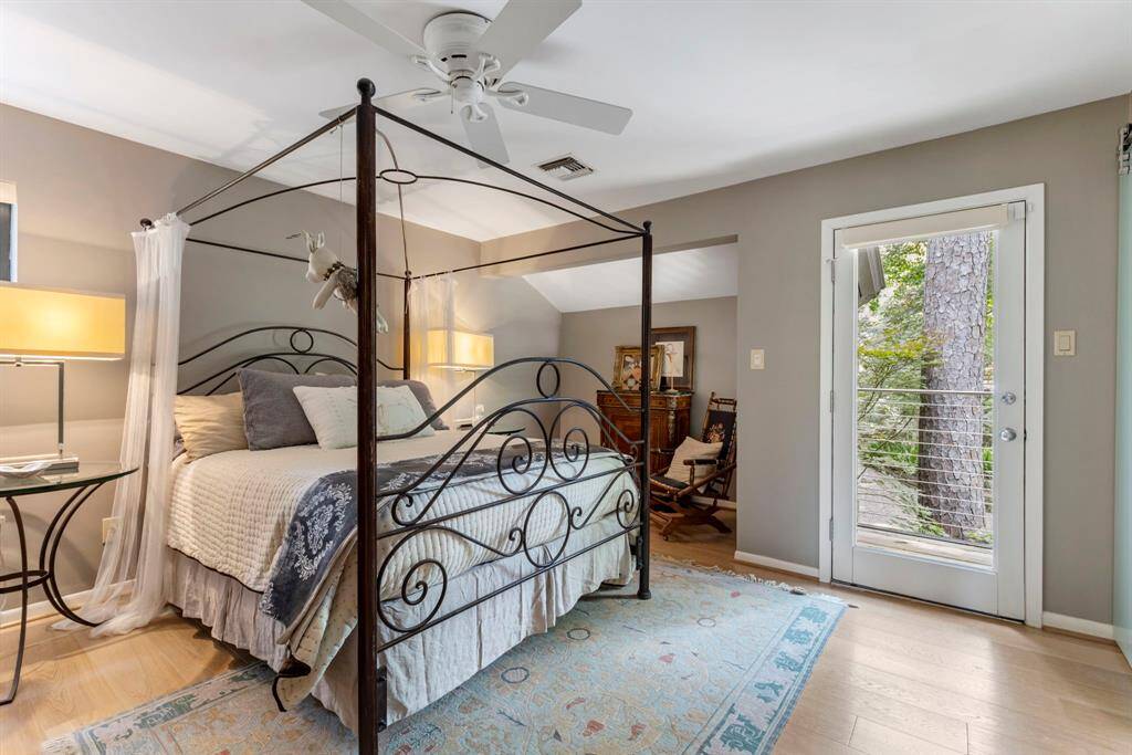 Another of the homes spacious bedrooms with sitting or study nook and balcony.
