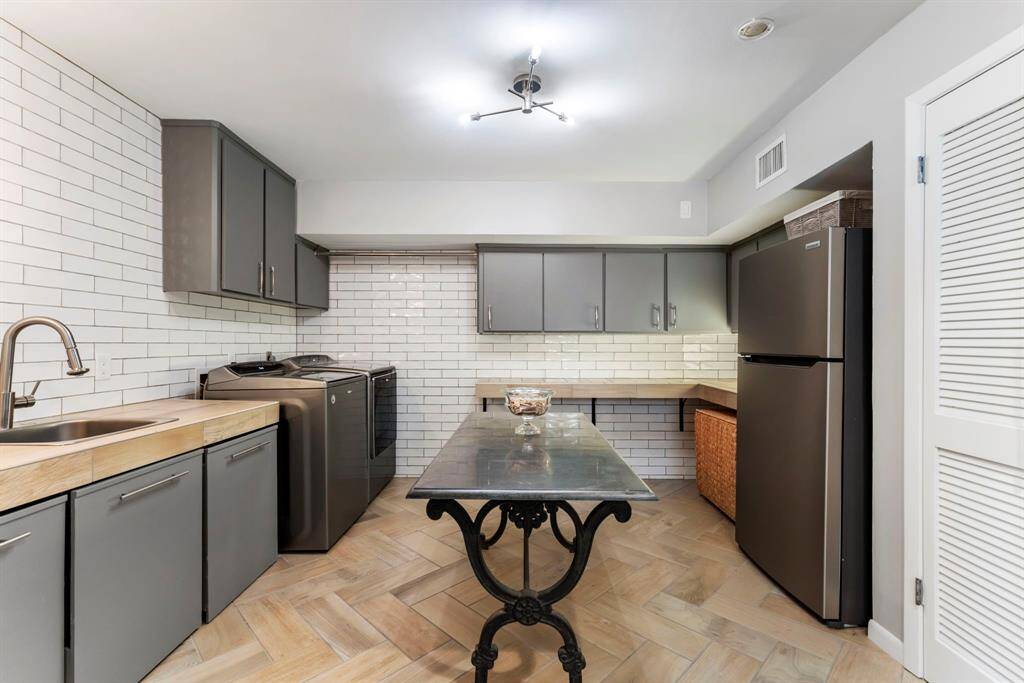The laundry room also has space for a full size refrigerator.