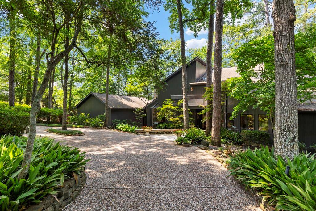 A private, circular drive opens to a spectacular property showcasing incredible architectural elements that take advantage of this beautiful setting.