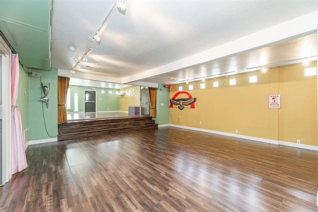 Entry and reception area facing the front door and covered porch just outside