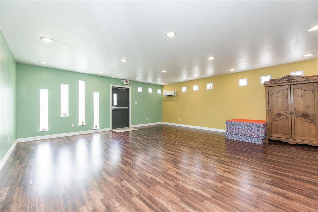 Kitchen area and large studio space for yoga or events.