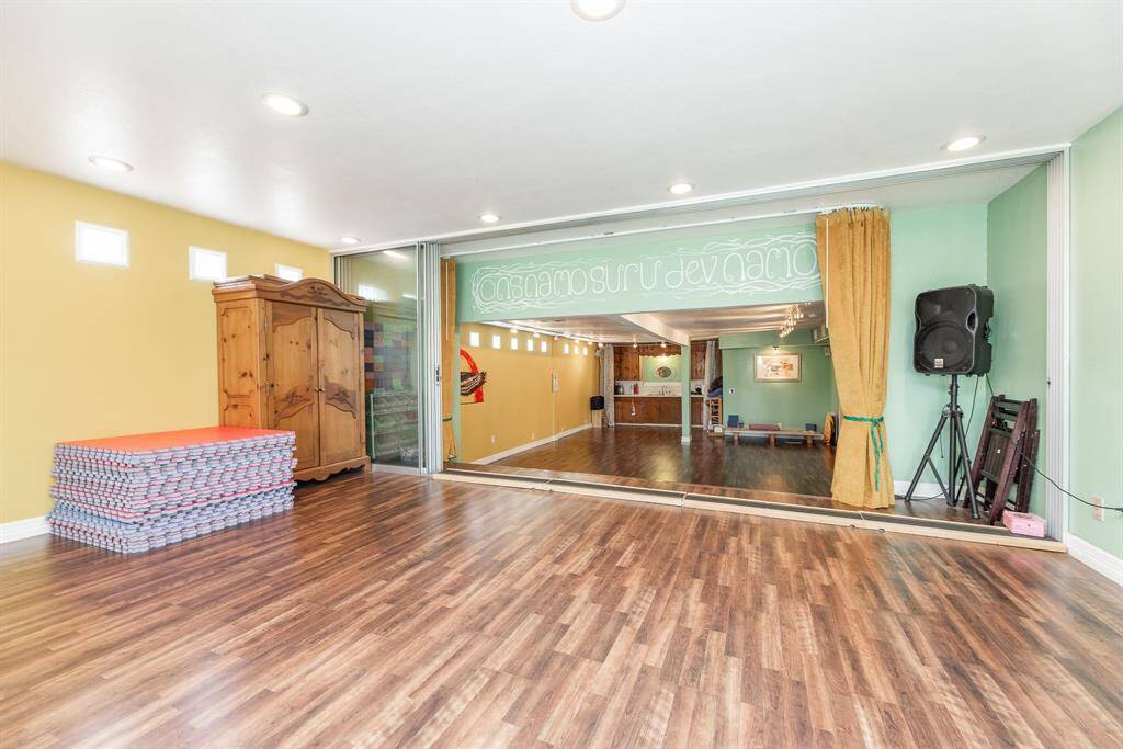 Expansive room extends just up the steps