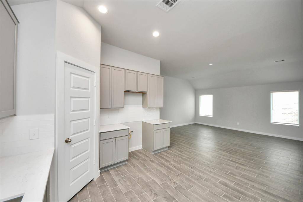 All of this overlooks your expansive family room, creating a perfect space for culinary delights and family gatherings.