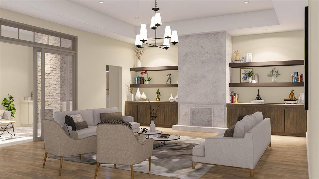 The great room features a 42" Isokern Magnum fireplace, built-in cabinets, tray ceilings, wood floors, and sliding doors that open to the covered patio. Rendering Image. Final finishes subject to change.