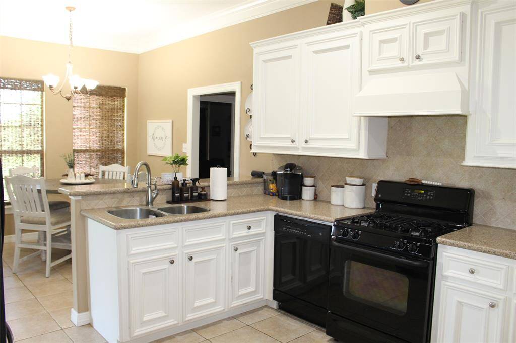 Granite countertops, 42 inch cabinets, gas range & refrigerator included.