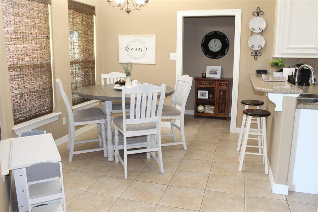 Breakfast area has 3 windows that overlook the huge backyard.