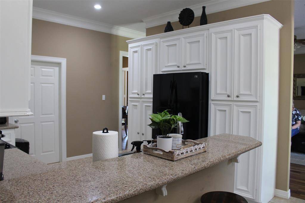 Look at all this storage around the refrigerator. Refrigerator is included.