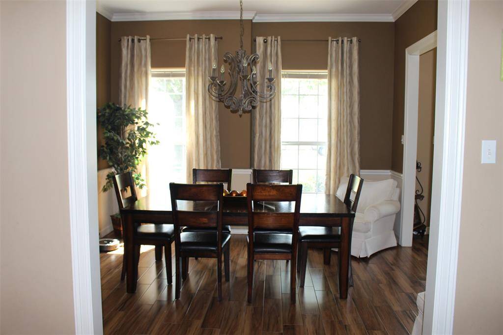 Formal Dining with double widows facing east to allow that morning sunshine to come in.