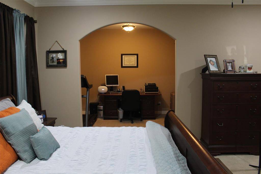 Primary Bedroom, with extra space/room. This space is currently used as a home office, but would make a nice flex space, reading nook, nursery or crafting space.