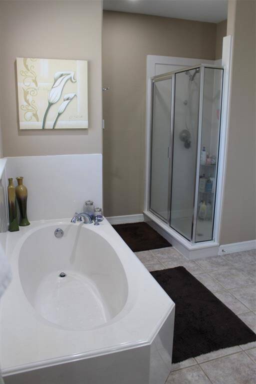Primary Bath has soaking tub and separate shower.
