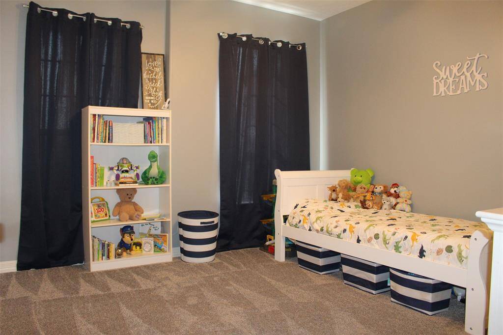Bedroom 1 is 12x12 and offers double closet doors,  lots of play room and views of the front yard.