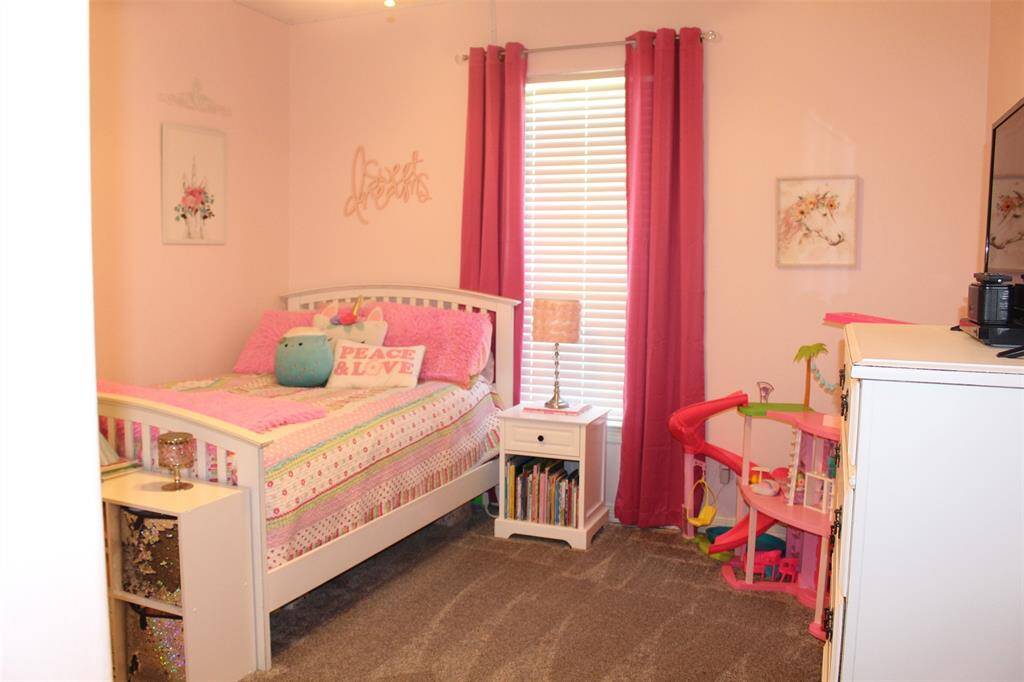 Bedroom 2 is 12x12 and offers view of the back yard with lots of play room.