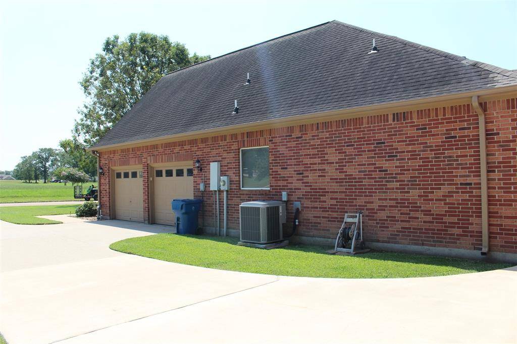 Side of home showing two car attached garage.
