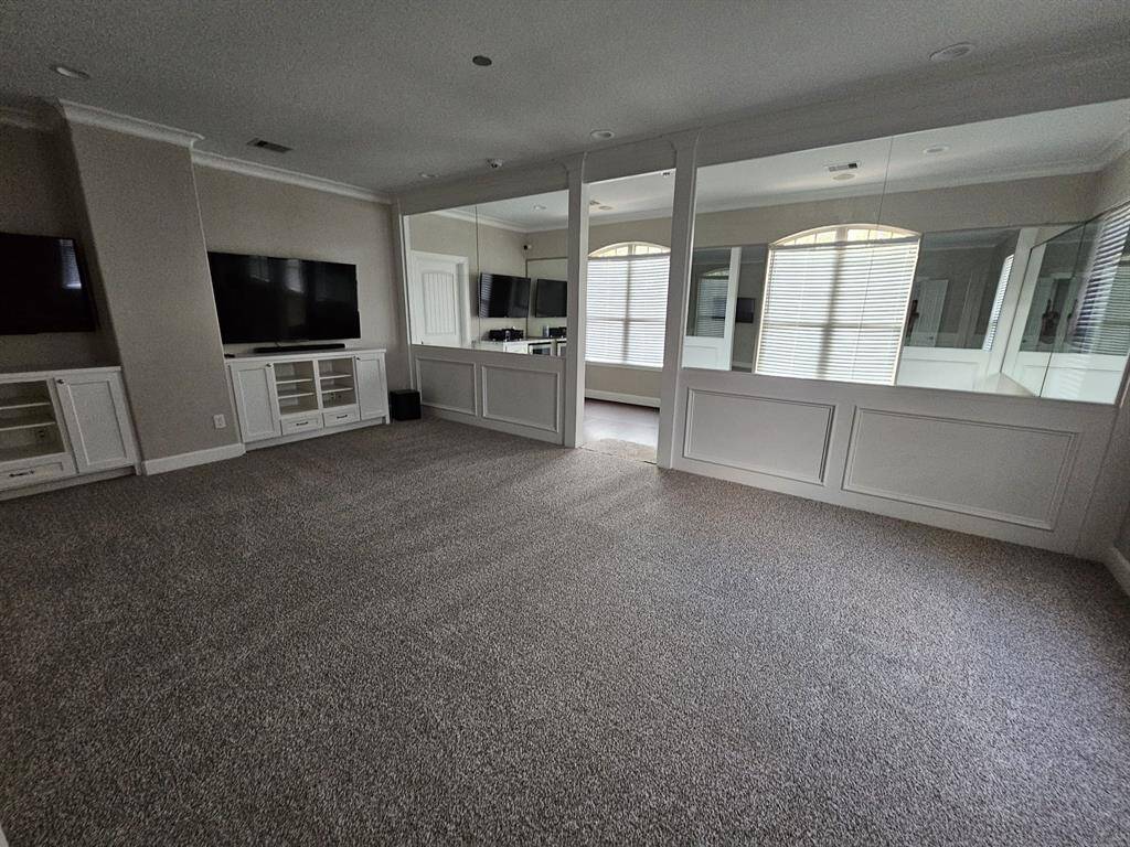 Oversized game room with separate gym area.