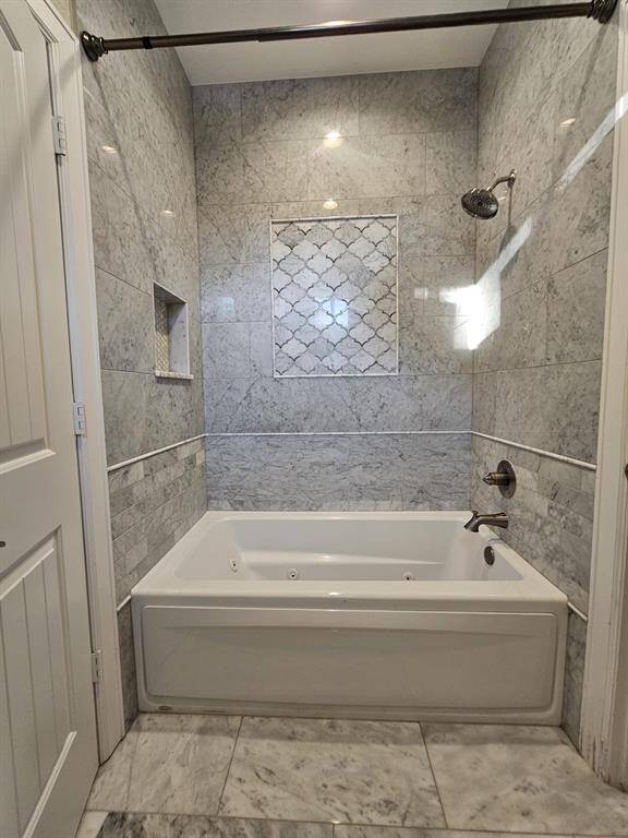 Shared jack and jill jacuzzi tub with entrance to both rooms