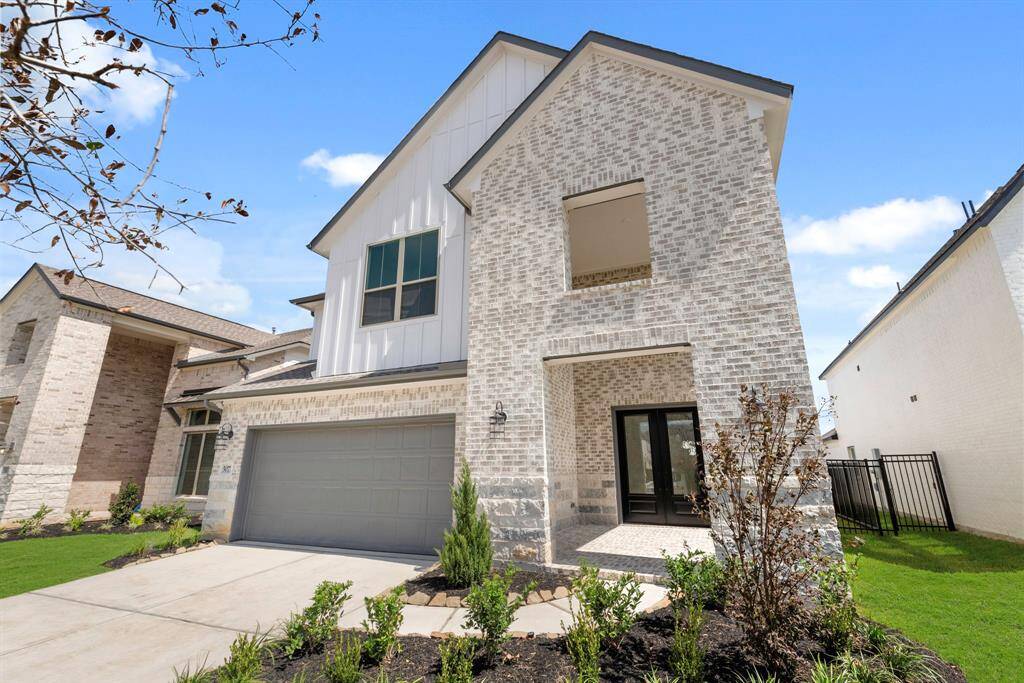 MOVE IN READY!! Westin Homes NEW Construction (Soho, Elevation A) Two story. 4 bedrooms. 3.5 baths. Green grass added to enhance photo.
