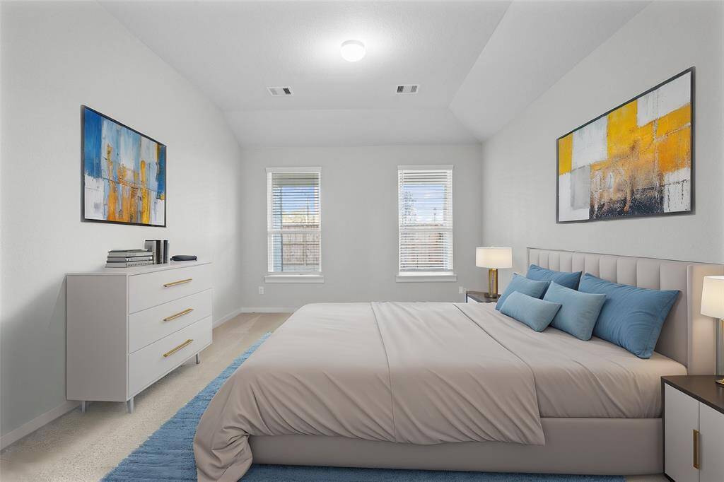 Come and unwind after a long day in this magnificent primary suite! This spacious room features plush carpet, warm paint, high ceilings, and large windows with privacy blinds!