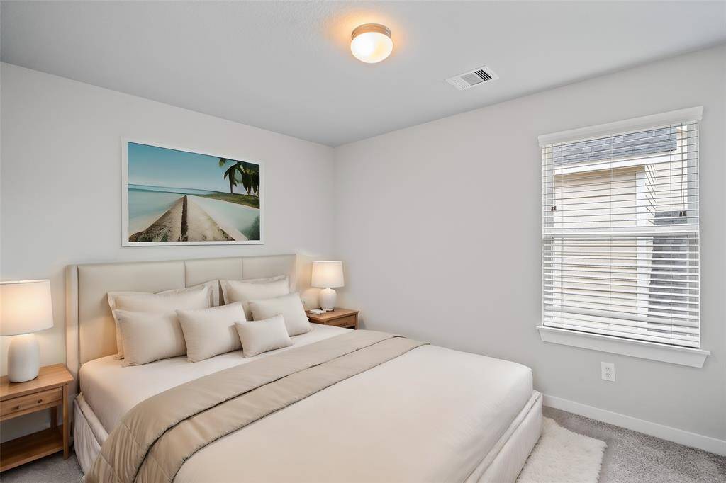 This spacious and bright room features custom paint with gorgeous plush carpet, and large windows with privacy blinds! With the ample amount of space provided, you can turn this area into anything! From a game room to a children's play room, the possibilities are endless!