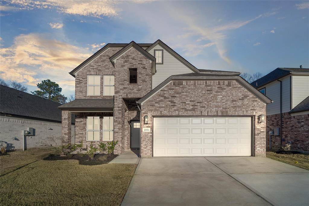 Welcome home to 1951 Scarlet Yaupon Way located in Barton Creek Ranch and zoned to Conroe ISD.