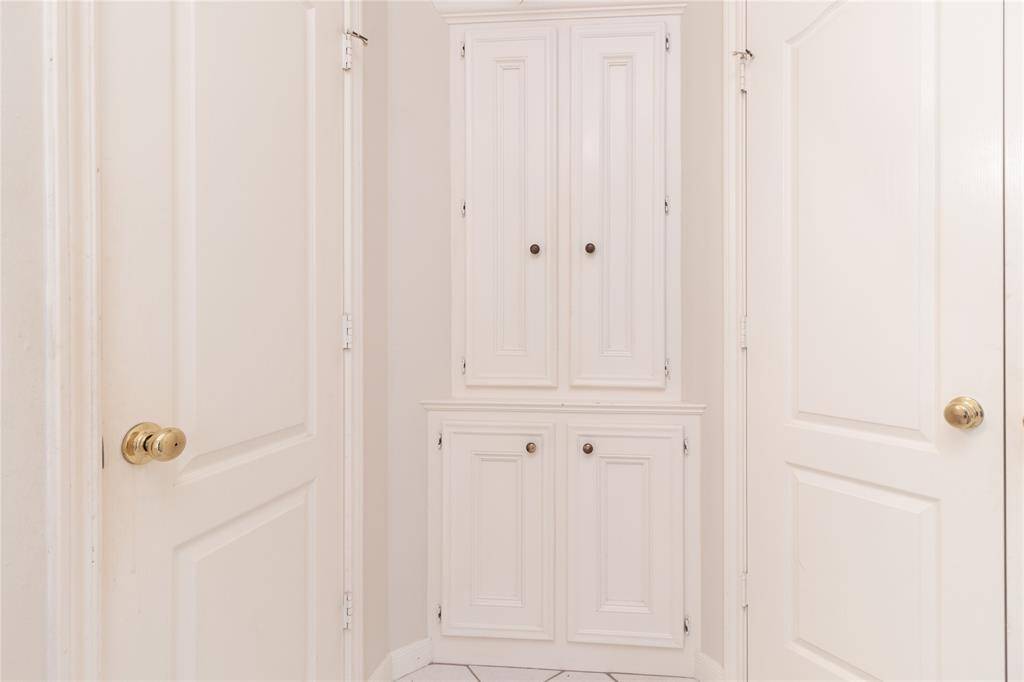 Primary bathroom water closet, storage closet, and walk-in closet