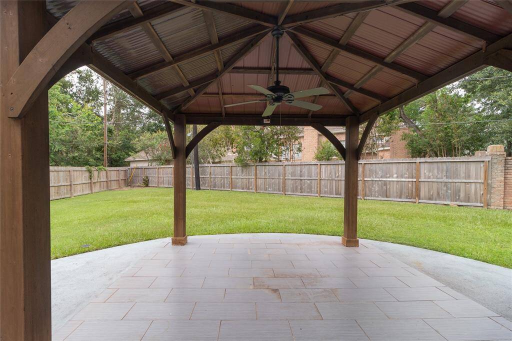 Covered patio area with ceiling fan