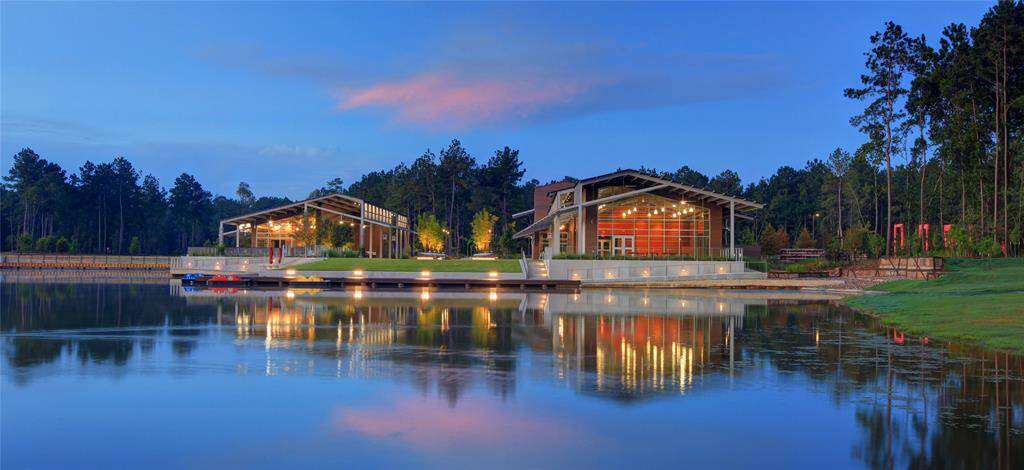 5 acre lake and amenity center with cafe, gym, meeting spaces, and play area.