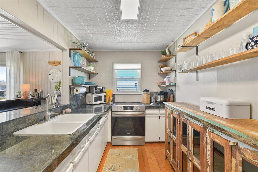 Open shelving adds to the open feel of the kitchen.