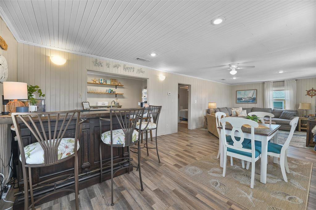 The open concept living features ship lap ceilings.