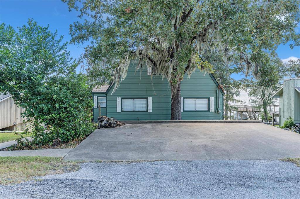 This is a two-story home featuring a concrete driveway