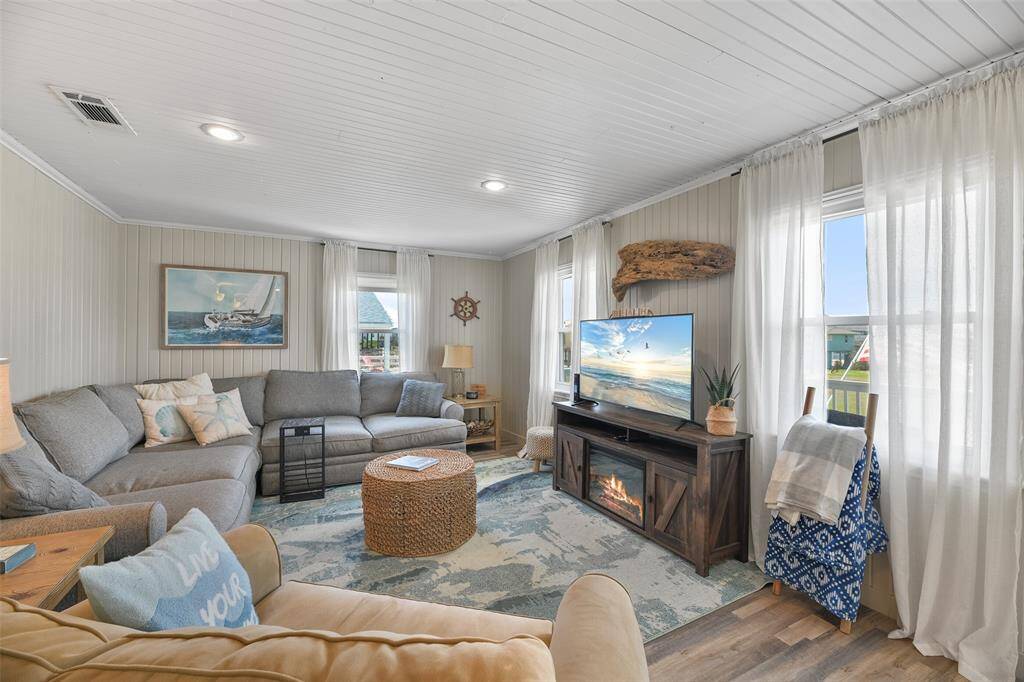Did you notice all the paneled walls. They add so much character to this coastal cutie.