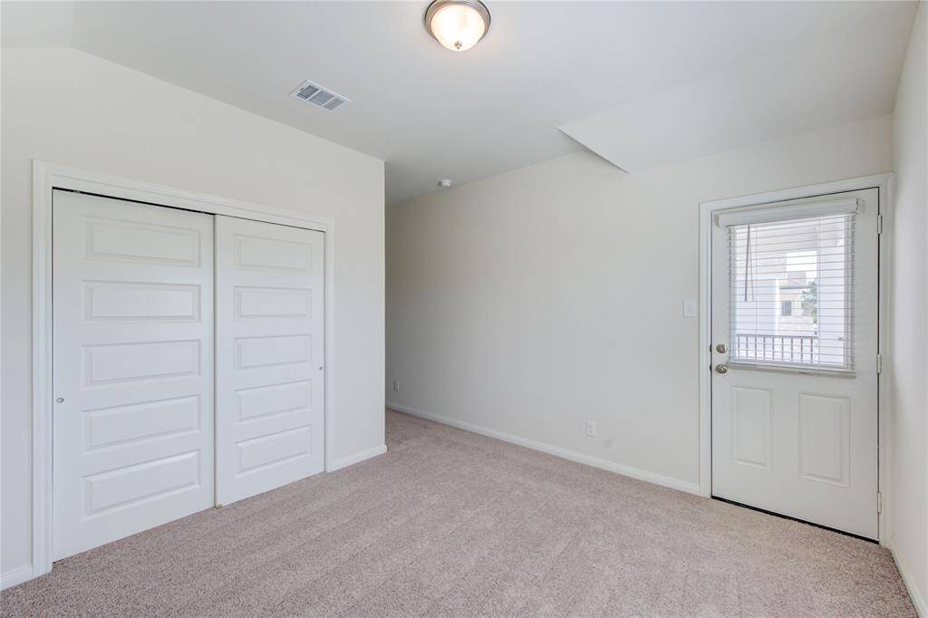 SEcondary Bedroom with access to upstairs porch