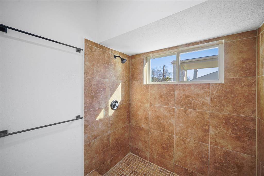 The Primary Bathroom shower includes a beautiful tile shower wall.