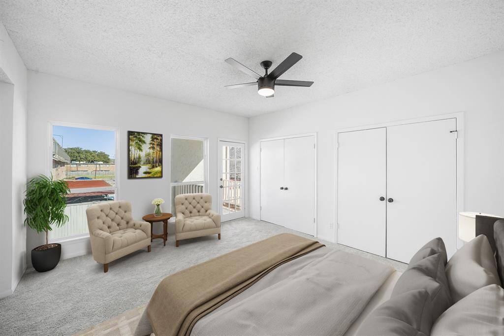 Virtually Staged: Wonderfully appointed secondary bedroom, featuring neutral paint, plush carpet, large windows, a ceiling fan, built-in closets and direct acess to the second floor balcony which is an additional feature of this bedroom. This room is complete with an en-suite bathroom.