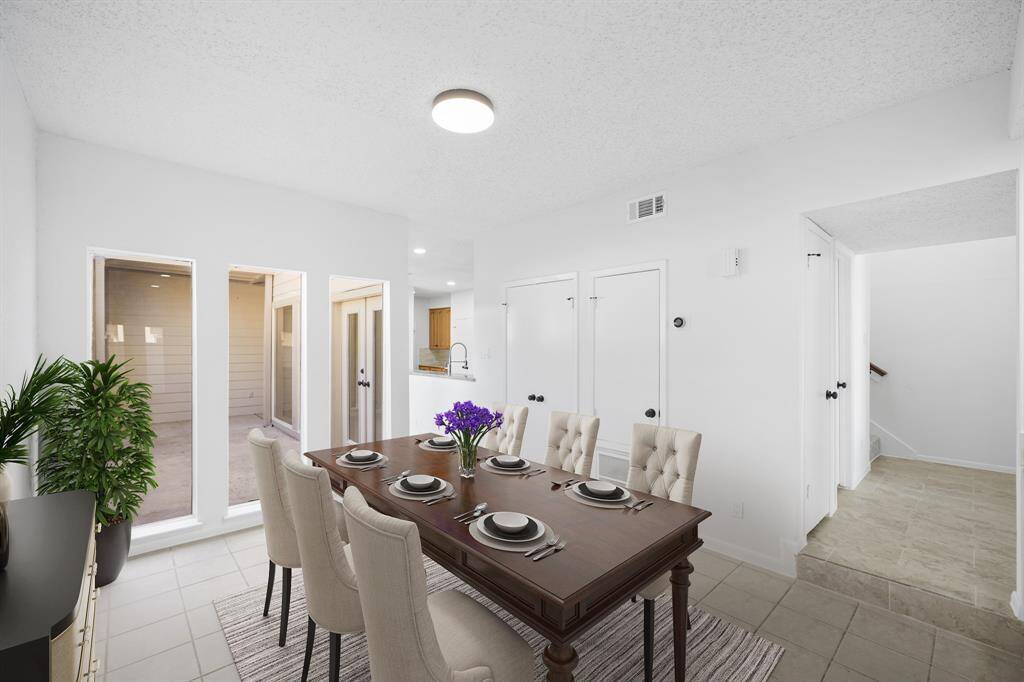 Virtually Staged: Spacious dining room with tile floors, and perfect lighting.