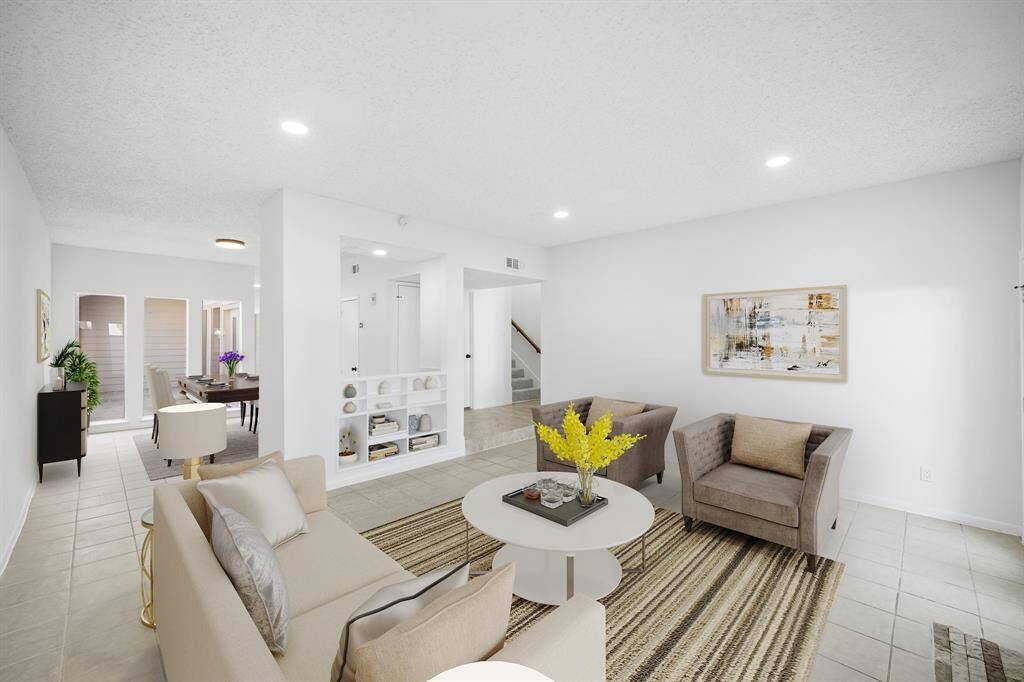 Virtually Staged: Fantastic open layout between the living room and dining room. It includes a wet bar. An entertainer's dream!